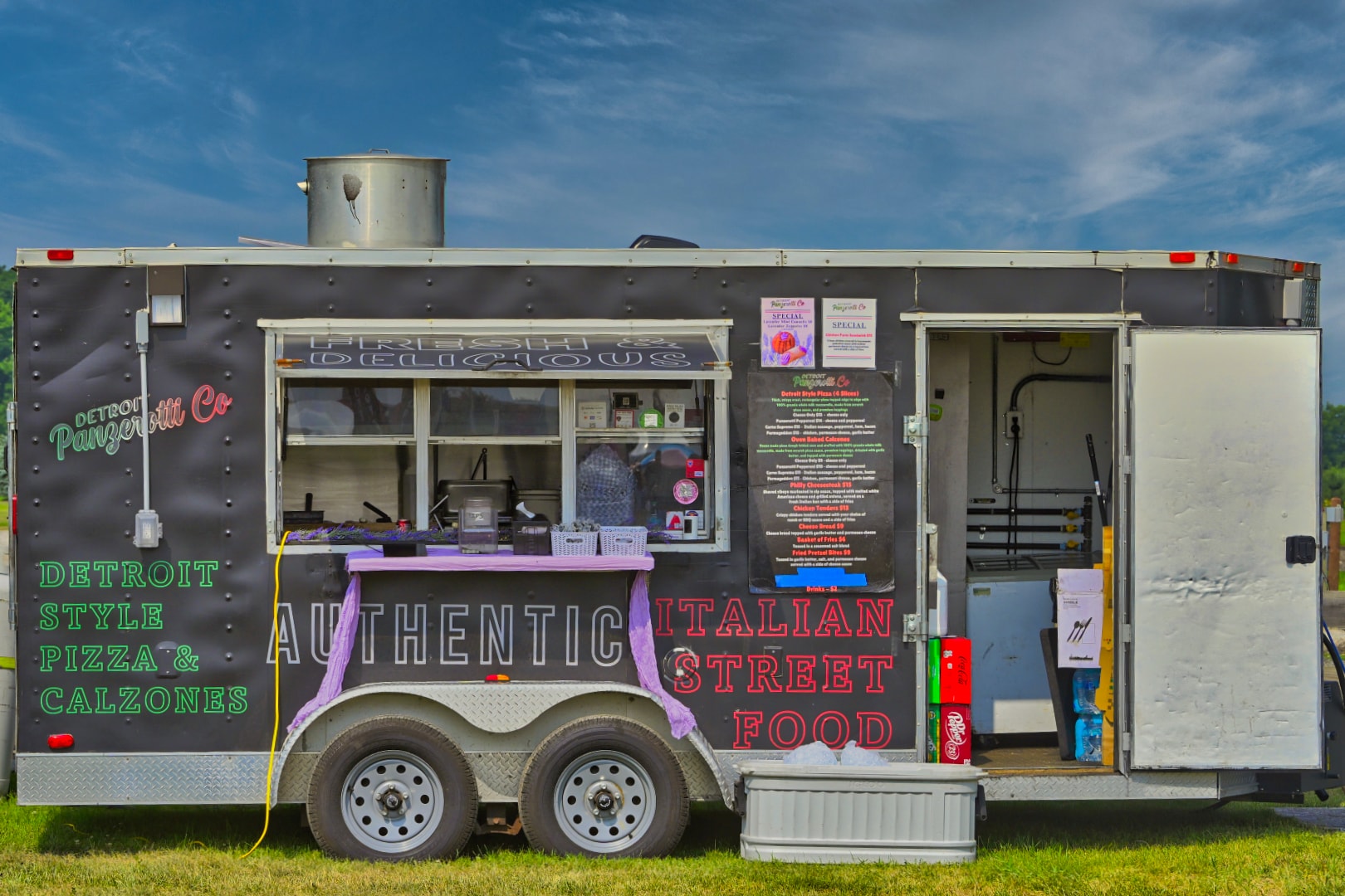 Detroit Panzerotti Co. food trailer advertising authentic Italian street food — Detroit style pizza and calzones — at Blake's Lavender Festival, Armada Michigan — Michigan food truck and festival event photography by Atelier Lens LLC