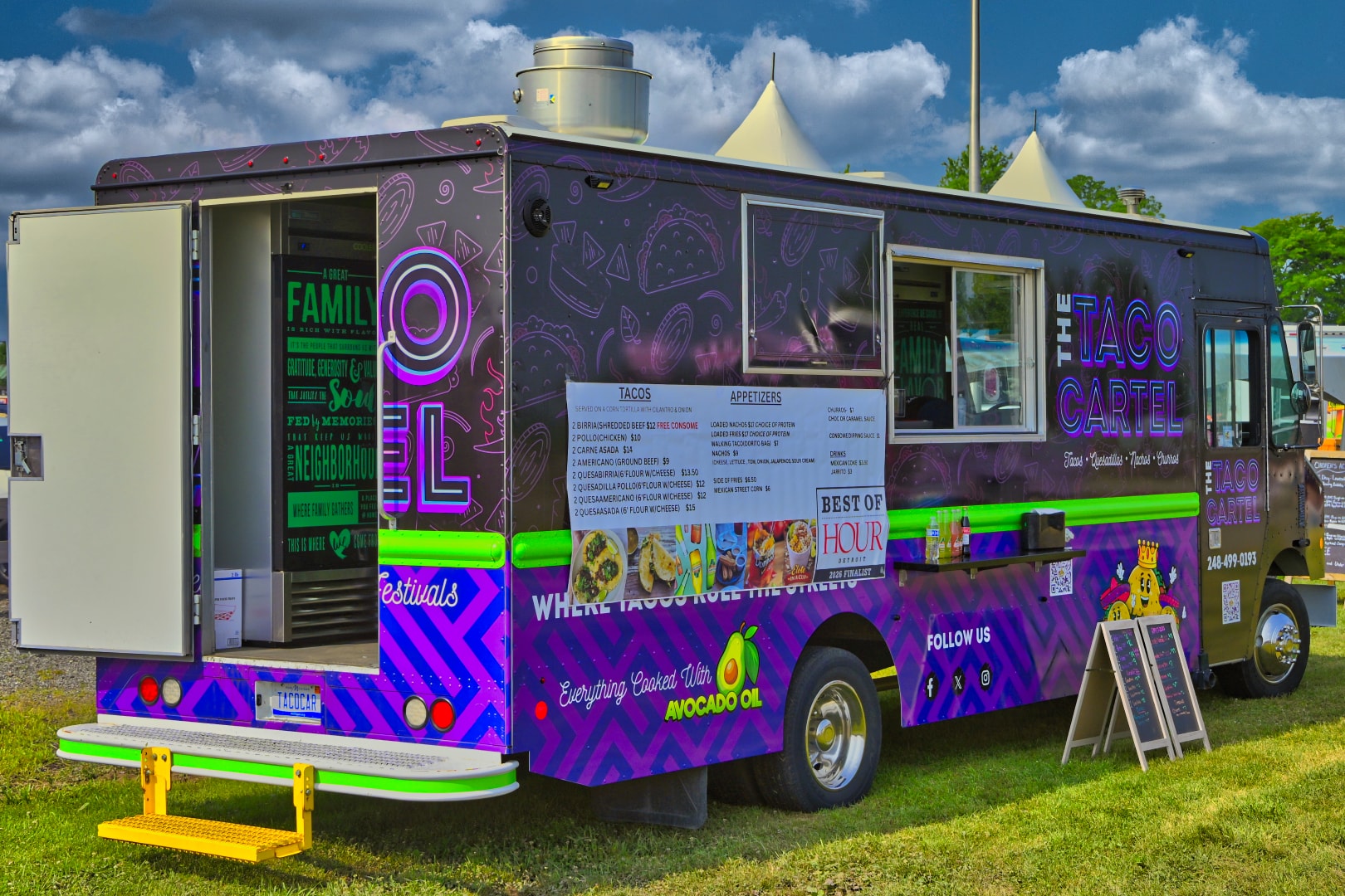 The Taco Cartel food truck with vivid purple and green wrap, Best of Hour Detroit finalist signage, serving tacos, quesadillas, nachos, and churros at Blake's Lavender Festival, Blake's Apple Orchard, Armada Michigan — food truck event photography by Atelier Lens LLC