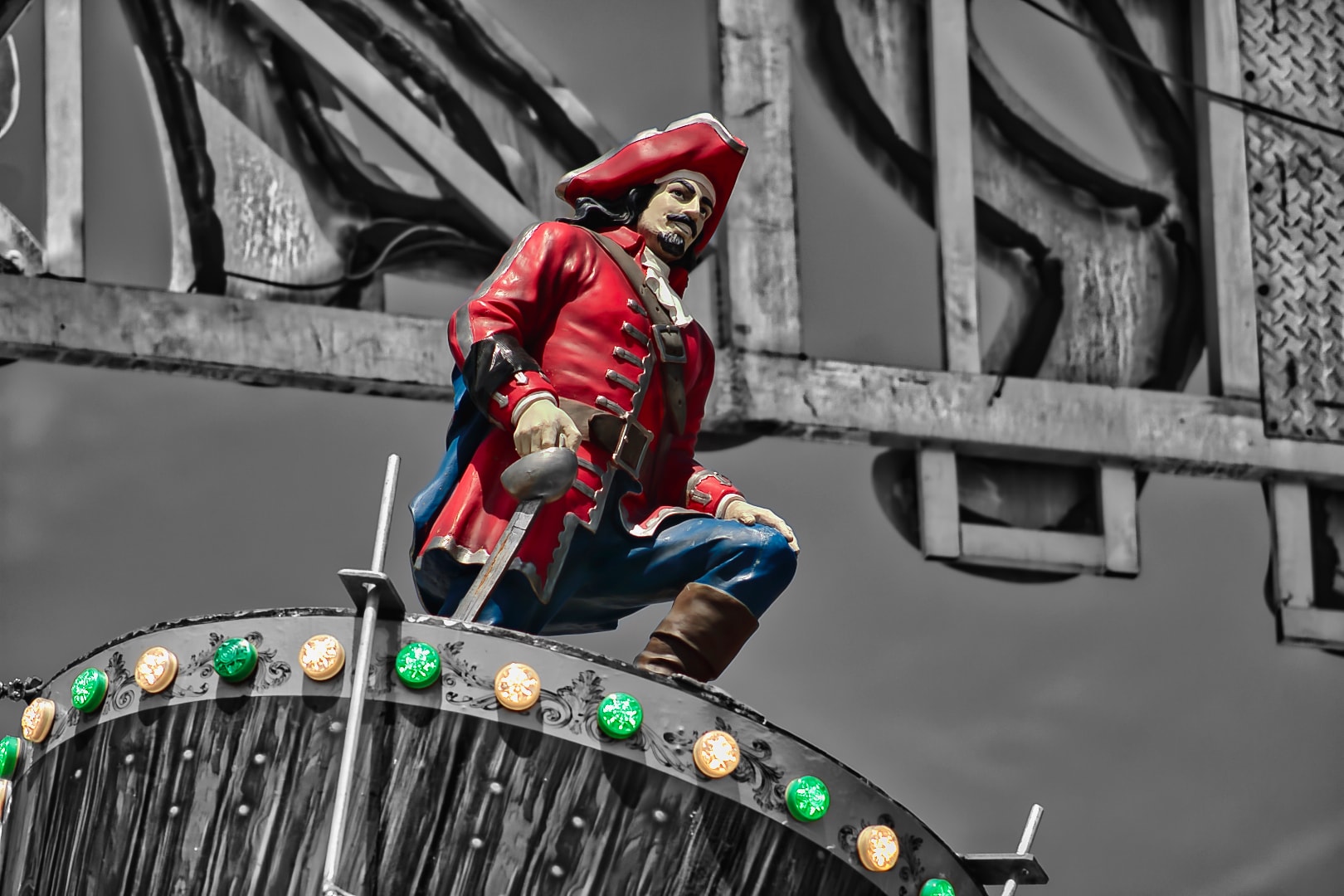 Signature Modern Vintage selective color edit — pirate figurine with red coat and green lights preserved against black and white background, Pickerel Tournament Algonac Michigan, Atelier Lens LLC