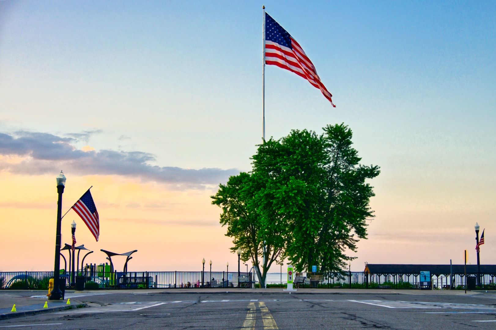 American flag at sunrise over Anchor Bay — Walter & Mary Burke Park, New Baltimore Michigan