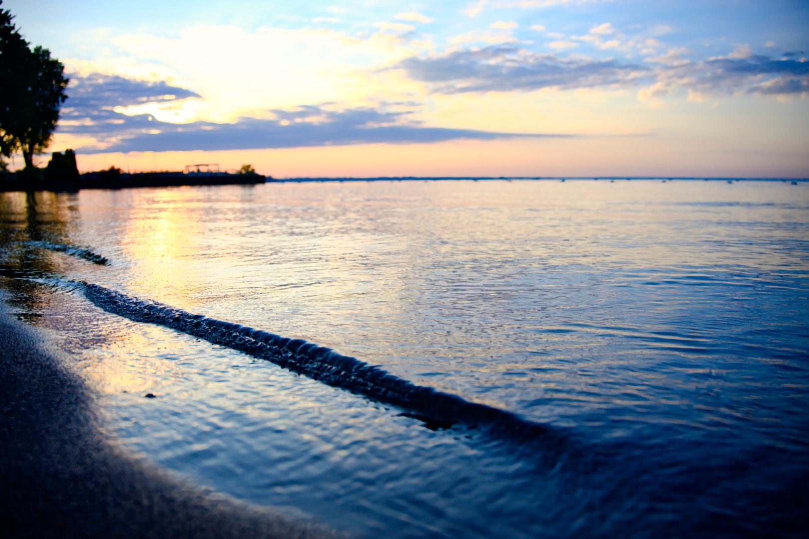 Anchor Bay beach swim area at sunrise with bokeh shoreline detail — Burke Park New Baltimore Michigan by Atelier Lens LLC