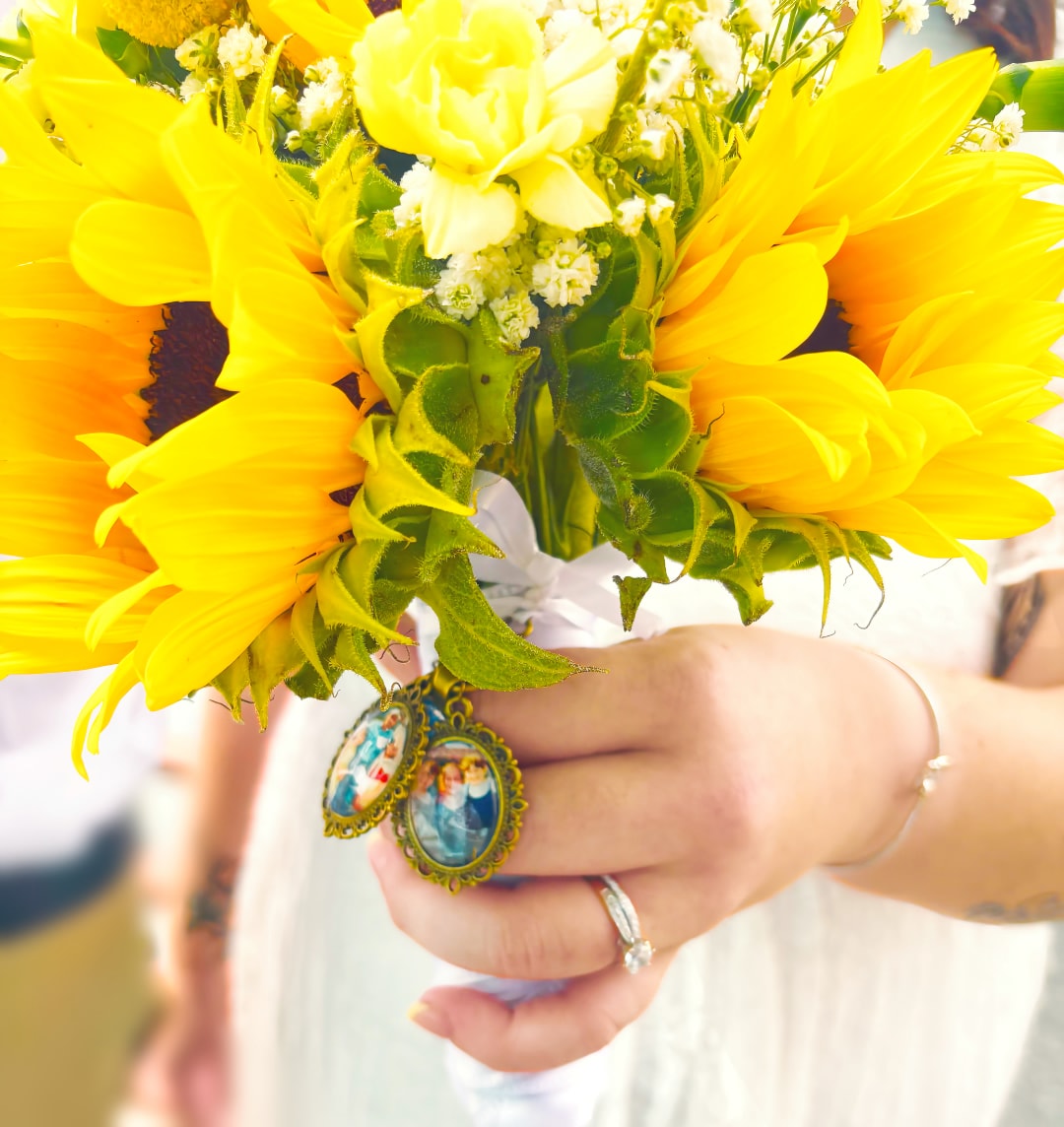 Sunflower bridal bouquet with vintage locket charms — fine art wedding photography, Michigan