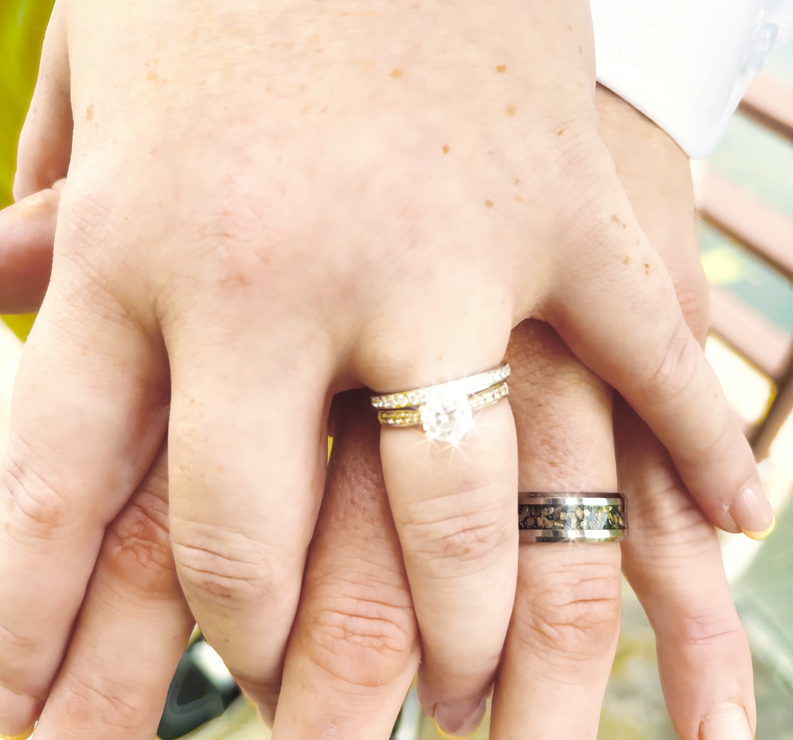 Wedding rings on hands close-up — natural light detail photography by Atelier Lens LLC